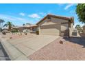 Inviting single story home with low-maintenance desert landscaping and two-car garage at 3755 N 151St Ave, Goodyear, AZ 85395