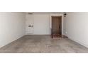 Large parking area with an entryway featuring a decorative front door and white walls at 4950 N 78Th St, Scottsdale, AZ 85251