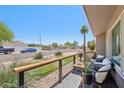Inviting front porch with cozy seating area, perfect for relaxing outdoors with a view of the desert landscape at 5614 N 20Th Dr, Phoenix, AZ 85015
