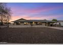 Charming single-story home with desert landscaping and attached carport at 6802 E Oak St, Scottsdale, AZ 85257