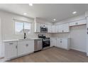 Bright kitchen features white cabinets, stainless steel appliances, and marble countertops at 733 W El Prado Rd, Chandler, AZ 85225