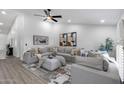 Spacious living room with high ceilings, stylish decor, comfortable seating, and natural light at 8449 W Rockwood Dr, Peoria, AZ 85382