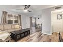 Open-concept living room and dining area with wood floors and bright natural light at 8538 E Portland St, Scottsdale, AZ 85257