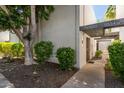 Apartment building featuring desert landscaping, a white exterior, and the unit number visibly displayed at 8552 E Indian School Rd # B, Scottsdale, AZ 85251