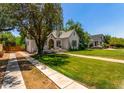 Charming single-story home with a well-manicured lawn and mature trees in a quiet neighborhood at 917 W Willetta St, Phoenix, AZ 85007