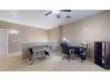 Versatile bonus room with a foosball table, desk, and chair, creating a great space for work or play at 16807 W Carmen Dr, Surprise, AZ 85388