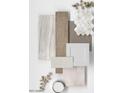 An array of neutral and white samples featuring floor tiles, wooden panels, and cabinet finish options at 17567 W Pierson St, Goodyear, AZ 85395