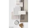 Beautiful collection of interior samples showing coordinating tiles, paint colors, cabinet door, and hardware at 17667 W Mariposa Dr, Goodyear, AZ 85395