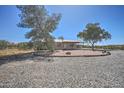 Ranch-style home with low-maintenance gravel yard and views of distant mountain at 2627 W Buckskin Trl, New River, AZ 85087