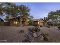 Beautiful single-story home featuring a circular driveway and low maintenance desert landscaping at 28897 N 94Th Pl, Scottsdale, AZ 85262