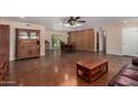 Open concept living room leading into the dining area and featuring stained concrete floors at 3030 E Shangri La Rd, Phoenix, AZ 85028