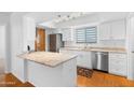 Modern kitchen boasts stainless steel appliances, granite countertops, and wood flooring at 3031 N Civic Center Plz # 317, Scottsdale, AZ 85251