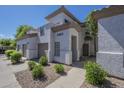 Beautiful exterior view showcasing desert landscaping and stucco architecture on a bright, sunny day at 3236 E Chandler Blvd # 2003, Phoenix, AZ 85048