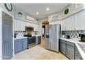 Well-lit kitchen featuring stainless steel appliances, sleek countertops, and modern backsplash at 4328 W Judson Dr, New River, AZ 85087