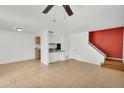 Spacious living room with tile flooring, stairs, and light colored walls at 600 S Dobson Rd # 178, Mesa, AZ 85202