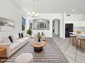 Bright living room with neutral decor, stylish furniture, and an open floor plan at 7316 E Fledgling Dr, Scottsdale, AZ 85255
