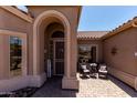 Inviting front porch with comfortable seating, perfect for relaxing at 7762 E Russell Cir, Mesa, AZ 85207