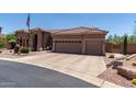 Expansive driveway and three-car garage offer ample parking at 7762 E Russell Cir, Mesa, AZ 85207
