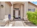 Welcoming front porch with a charming 'Welcome' sign and space for decorative plants at 871 N Granada Dr, Chandler, AZ 85226