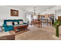 Open-concept living space with cozy seating, dining area, and seamless flow into the kitchen at 871 N Granada Dr, Chandler, AZ 85226