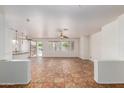 Bright, open-concept living area with tile flooring and neutral paint at 9563 E Keats Ave, Mesa, AZ 85209
