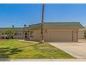 Single-story home with desert landscaping and attached two-car garage at 10505 W Campana Dr, Sun City, AZ 85351