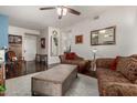 Spacious living room with stylish furniture, ceiling fan, and hardwood floors at 11375 E Sahuaro Dr # 1062, Scottsdale, AZ 85259