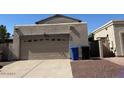 Attached garage with space for two cars, complemented by adjacent bins at 1402 E Wescott Dr, Phoenix, AZ 85024