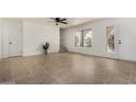 Spacious living room with tiled flooring, natural light, and a ceiling fan at 16336 E Palisades Blvd # 4, Fountain Hills, AZ 85268