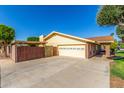 Spacious two-car garage and extended driveway for extra parking at 1704 E Hackamore St, Mesa, AZ 85203