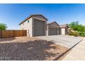 Charming single-story home with a three-car garage, private entrance, and fenced in yard at 1736 E Joelle Dr, Casa Grande, AZ 85122
