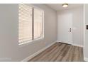 Entryway featuring wood-look flooring and a large window offering natural light at 2625 E Beverly Rd, Phoenix, AZ 85042