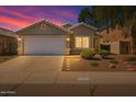 Charming single-story home showcasing a manicured front yard and attached two-car garage at 2625 E Beverly Rd, Phoenix, AZ 85042