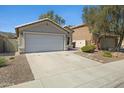 Charming single-story home with a two-car garage and low-maintenance desert landscaping at 2625 E Beverly Rd, Phoenix, AZ 85042