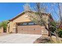 The home has a two-car garage with beautiful stone accents and desert landscaping at 29159 N 128Th Ln, Peoria, AZ 85383