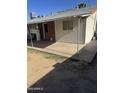 This home features a covered patio area for outdoor relaxation and enjoyment of the backyard at 3226 W Maryland Ave, Phoenix, AZ 85017