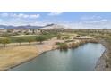 Beautiful aerial view of the golf course, water, and the scenic mountain backdrop at 33575 N Dove Lakes Dr # 2033, Cave Creek, AZ 85331