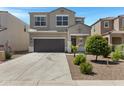 Inviting two-story home boasting a wide driveway, attached two-car garage, and desert landscaping at 4527 E Gagarinite Ln, San Tan Valley, AZ 85143