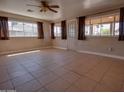 Bright and airy living room with tile flooring and multiple windows at 7930 E Broadway Rd, Mesa, AZ 85208