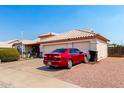 Beautiful single-Gathering home with desert landscaping, three-car garage, and modern exterior at 8053 E Dover St, Mesa, AZ 85207