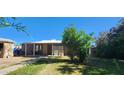 Charming home featuring a covered porch and a well-maintained lawn at 8527 W Jefferson St, Peoria, AZ 85345