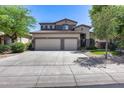 Attractive two-story home featuring a three-car garage, neutral color scheme, and well-maintained landscaping at 965 E Virgo Pl, Chandler, AZ 85249