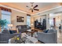 Inviting living room with plush seating, decorative lighting, and a seamless flow into the kitchen area at 965 E Virgo Pl, Chandler, AZ 85249