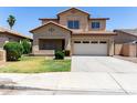 Charming two-story home with a well-manicured lawn and an attached two-car garage at 12426 W Adams St, Avondale, AZ 85323
