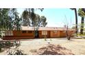 Charming single-story home featuring a well-maintained front yard with desert landscaping and an inviting entrance at 1417 W Rose Ln, Phoenix, AZ 85013
