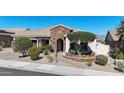 Beautiful single-story home showcasing desert landscaping and stone accents on the facade at 14725 S 182Nd Dr, Goodyear, AZ 85338