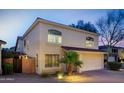 Charming two-story home with a two-car garage, well-maintained landscaping, and inviting curb appeal at 15550 N Frank Lloyd Wright N Blvd # 1040, Scottsdale, AZ 85260