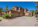 Spacious three car garage with large drive way and desert landscaping at 1808 S Sailors Way, Gilbert, AZ 85295