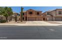 Charming two-story home with a spacious driveway and low-maintenance landscaping at 18903 N Shelby Dr, Maricopa, AZ 85138