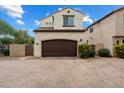 Inviting home featuring a brick driveway and a spacious two-car garage for easy access at 2004 E Heartwood Ln, Phoenix, AZ 85022